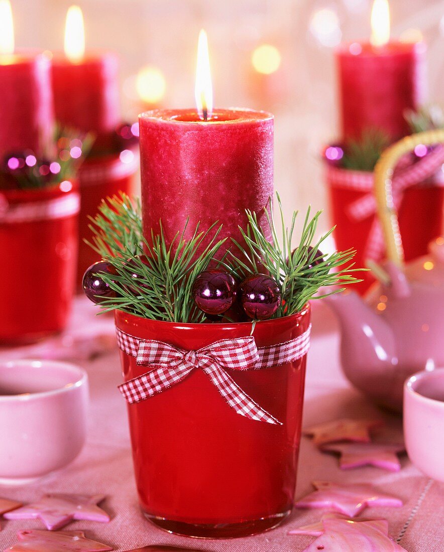 Advent candles (Red pillar candles with Christmas decorations)