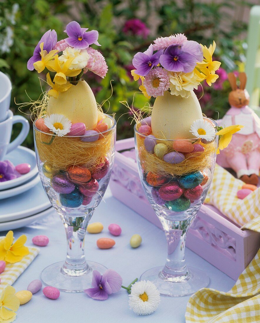Easter decoration: posies in blown eggs in glasses