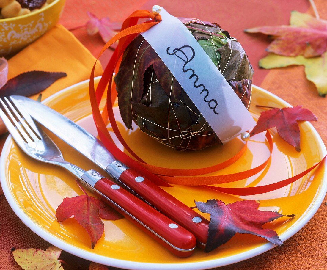 Ball of autumn leaves with name tag