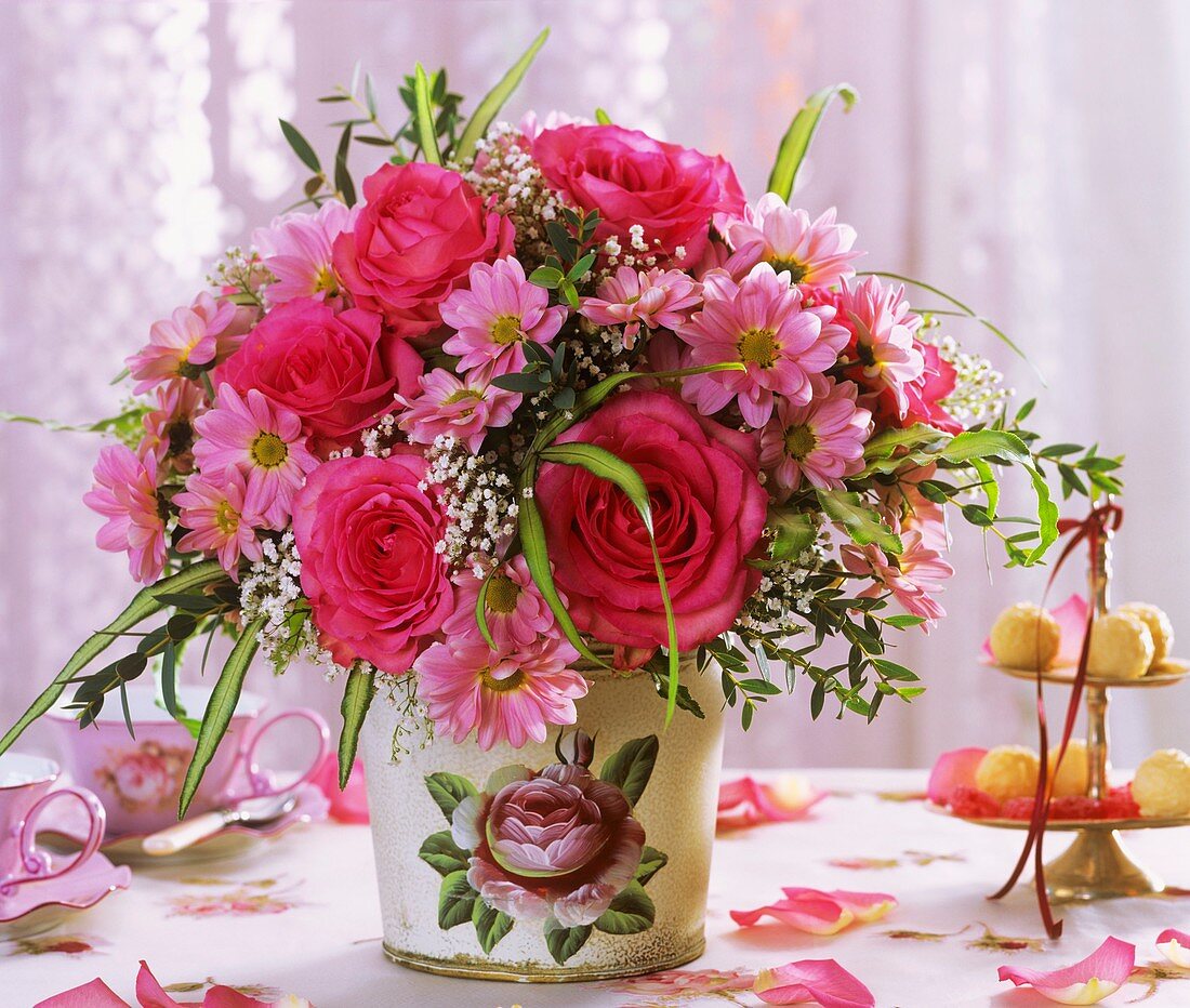 Roses, chrysanthemums and gypsophila in vase