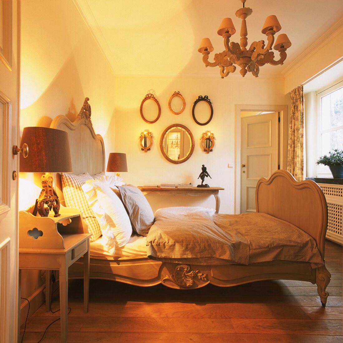 Bedroom with Baroque-style wooden bed and rustic bed linen