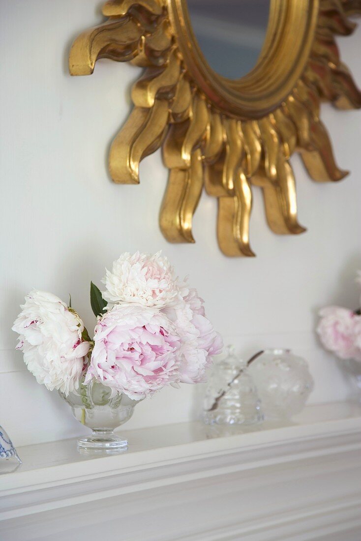 Vase of flowers on mantelpiece