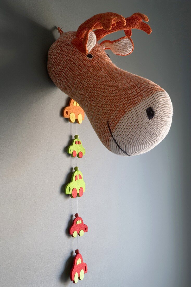 Soft toy hunting trophy on wall