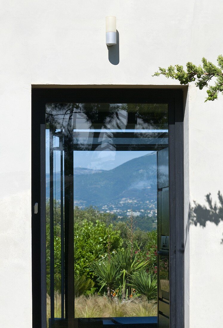 Window with view of landscape (Villa Nalu, Southern France)