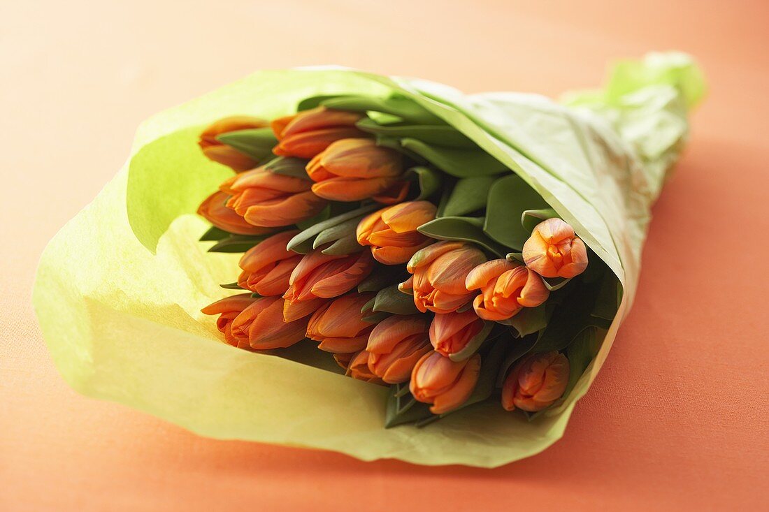 A bunch of tulips wrapped in paper