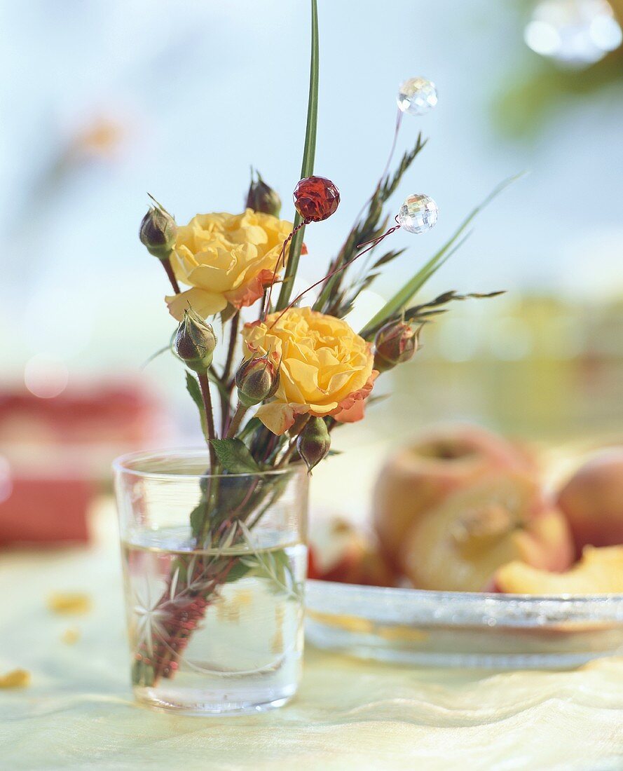 Posy of roses in a glass