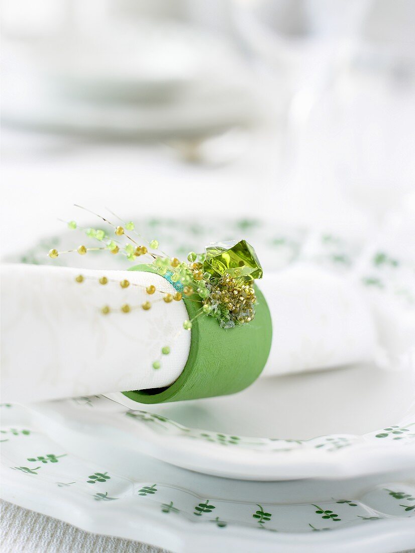 A place-setting with napkin and napkin ring