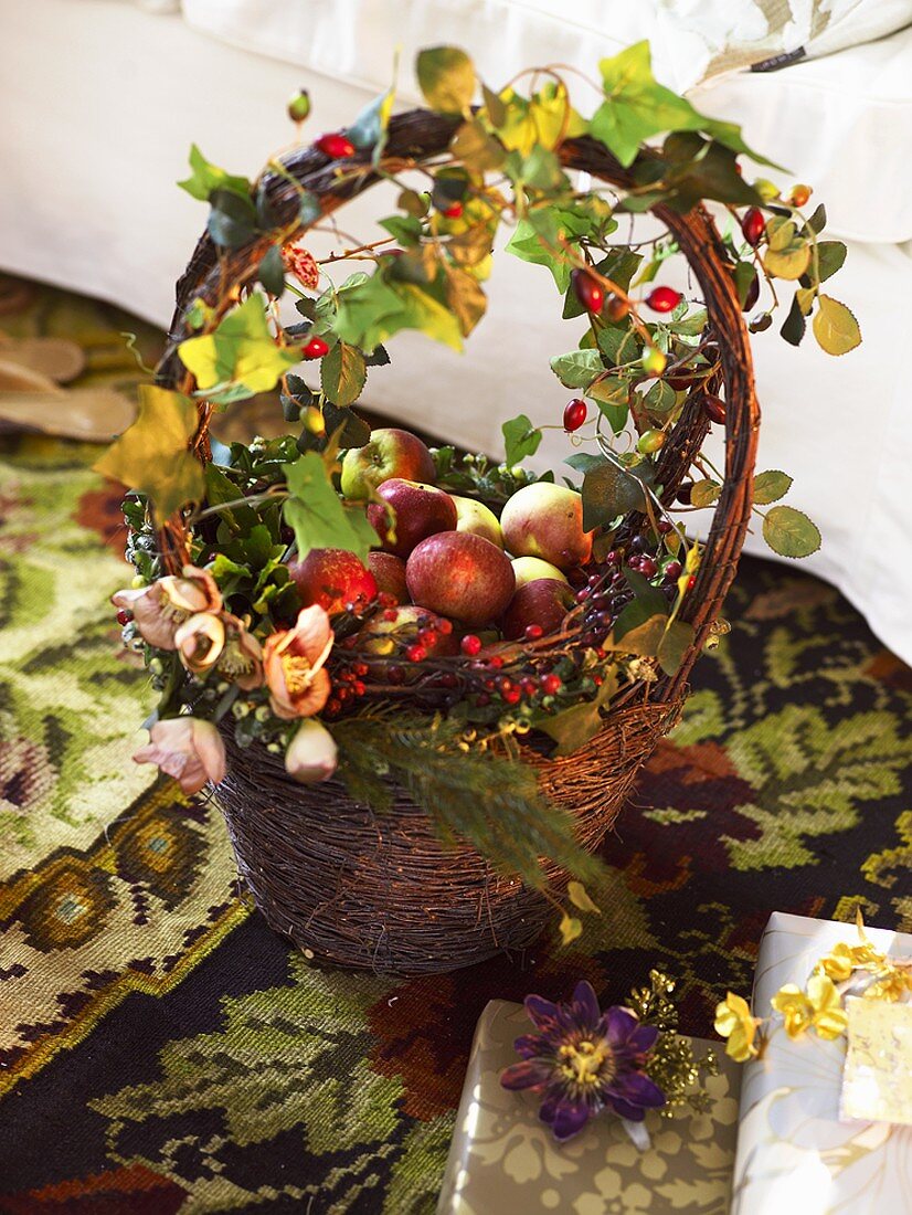 Decorated basket of apples and roses
