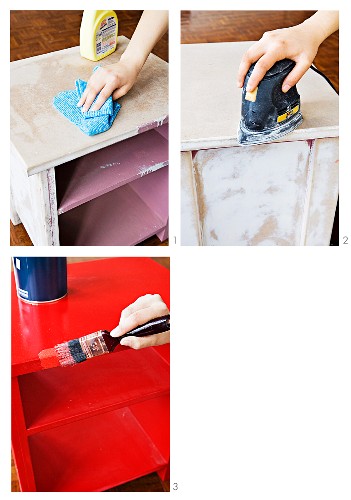 Woman's hands cleaning, sanding and painting an old cabinet red