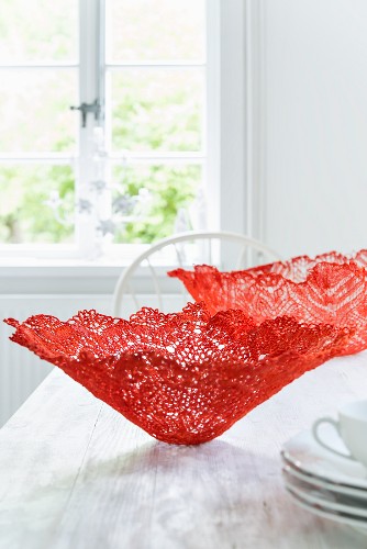 Homemade decorative bowls made from red lace