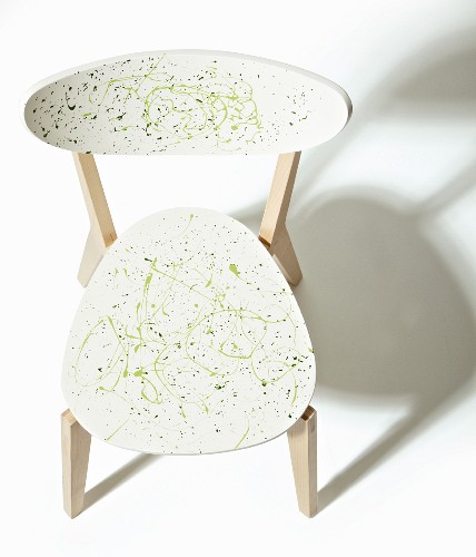 Wooden chair revamped with green splashes of paint