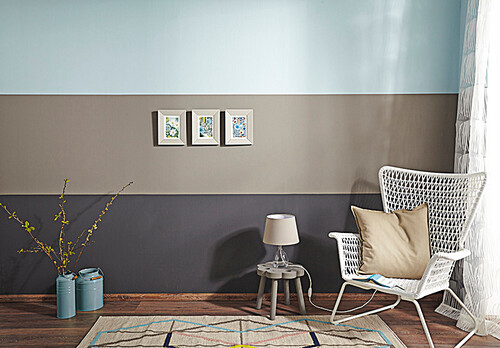 Wall painted with three broad striped in blue, taupe and black