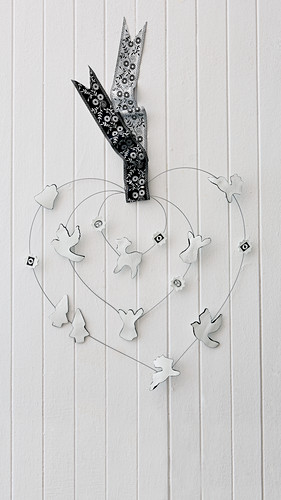 DIY wire heart decorated with festive air-dried clay figurines