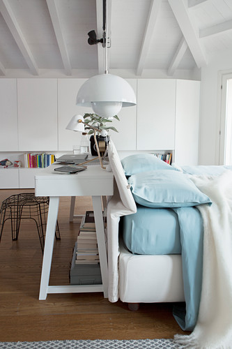 console table behind bed