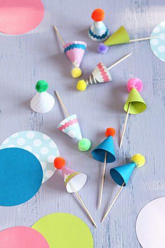 Toothpicks decorated with colourful, handmade party hats