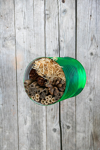 DIY insect hotel made from a tin can