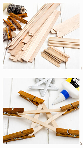 Holzstäbchen und -klammern für Bastelprojekte auf weißem Untergrund