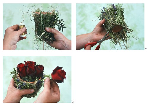 Arranging roses in terracotta pot with twigs