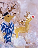 Two gingerbread reindeer with glittery winter decoration