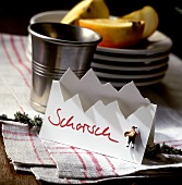 Alpine style place-card with the word "Schorsch"