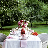 Table with berry desserts in open air
