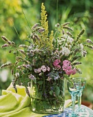 Bunch of wild flowering herbs in a vase