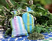 Two scented cushions with fresh and dried herbs