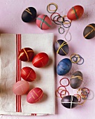 Coloured Easter eggs with elastic bands