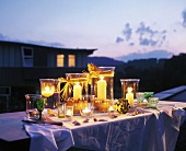 Table with garden lights shining in the twilight