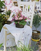 Flower arrangement on a chair in the open air