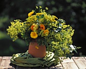 Marigolds with lady’s mantle and golden rod