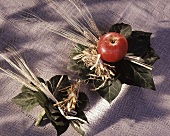 Small bouquet of cereals, apple and ivy leaves