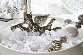 Christmas angel in white porcelain bowl with beads