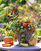 Harvest basket: pumpkins, peppers, tomato, chili, Clematis