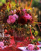 Arrangement of roses, dahlias, stonecrop, ornamental onions, ivy
