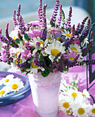 Early summer bouquet of ornamental sage, daisies and fine ray asters