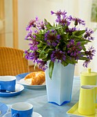 Vase of perennial cornflowers as table decoration