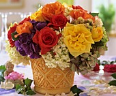 Colourful arrangement of roses and hydrangeas