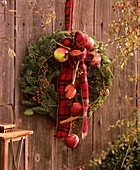 Door wreath with Noble fir, rose hips and ornamental apples