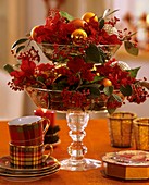 Tiered glass stand with Poinsettia and Cotoneaster