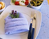 Place setting decorated with lavender and rosemary