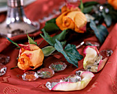 Orange roses with ivy and glass crystal