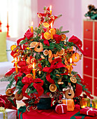 Korean fir decorated with nuts, oranges and red bows