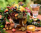 Arrangement: berries, ornamental apples, hydrangeas & carnations