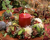 Table wreath of carnations, hydrangeas with candle