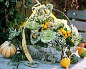 Basket with ornamental cabbage, gourds & peppers and Gypsophila