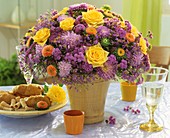 Arrangement of roses, chrysanthemums and asters