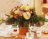 Arrangement of ornamental cabbage, pomegranates & birch wreath