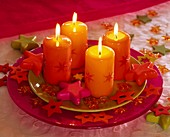 Candles on plates decorated with stars