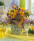 Arrangement of daffodils, Scilla, Viburnum and broom